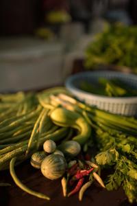 a bunch of vegetables sitting on a table at Chanhthida Riverside Guesthouse and The River Front Restaurant in Ban Khon