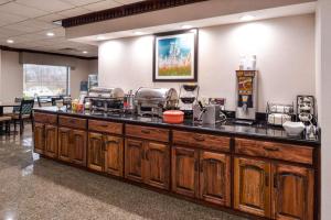 a kitchen counter with a bunch of appliances on it at Best Western Big Spring Lodge in Neosho