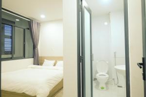 Koupelna v ubytování Dlux Saigon + 37 fotografií