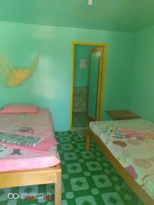 Valine Grace Cottages tesisinde bir odada yatak veya yataklar