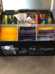 a drawer filled with different types of ties at Chambres d'Hôtes Chez Florence in Montmerle Sur Saône