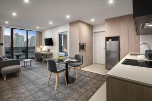 a kitchen and living room in a apartment at Quest NewQuay in Melbourne