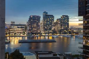 a view of a city skyline with a river and buildings at Quest NewQuay in Melbourne