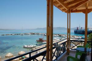 a view of a marina with boats in the water at Hotel Alexandra in Skala
