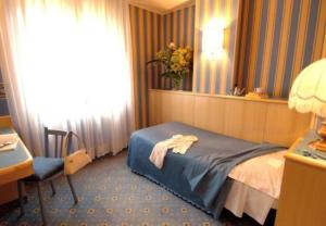Postel nebo postele na pokoji v ubytování Hotel Garda