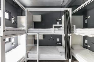 A bunk bed or bunk beds in a room at The Cocoon Hostel