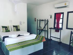 Postel nebo postele na pokoji v ubytování Papillon Bungalows + 20 fotografií