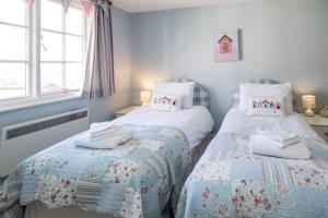 Postel nebo postele na pokoji v ubytování Ogilvie Lodge Apartment