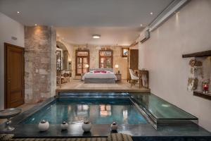 a house with a pool in the middle of a bedroom at Residenza Vranas Boutique Hotel in Chania Town