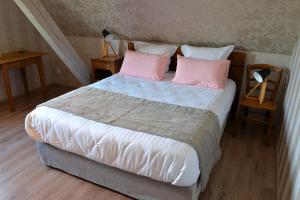 Letto o letti in una camera di Gîte Aux Deux Clochers