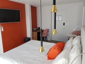 Postel nebo postele na pokoji v ubytování KYRIAD LYON EST – Saint Quentin Fallavier