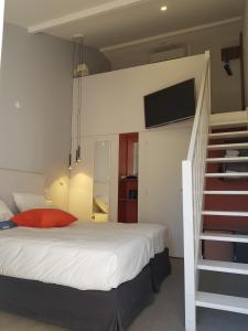 Postel nebo postele na pokoji v ubytování KYRIAD LYON EST – Saint Quentin Fallavier