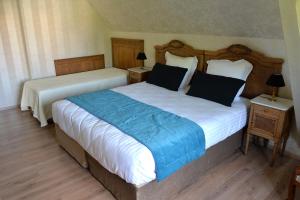 Letto o letti in una camera di Gîte Aux Deux Clochers