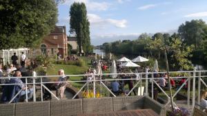 a group of people standing around in a park at Diglis House Hotel in Worcester