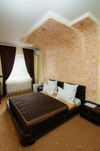Кровать или кровати в номере Шахерезада