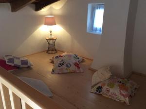 a room with three pillows and a lamp on the floor at CAN TONI DEN MESTRE in Cala Saona