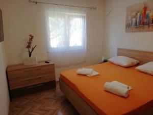 Postel nebo postele na pokoji v ubytování Apartman Marica