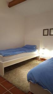 En eller flere senge i et værelse på Ferienhaus Schulenburg