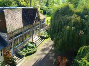 an aerial view of a house with a garden at Chambres d'Hôtes du Moulin du Vey in Clécy