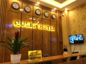 a hotel room with clocks on the wall at Queen Hotel in Tuy Hoa +21 photos