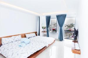 Postel nebo postele na pokoji v ubytování Ha Khoa Hotel Dalat