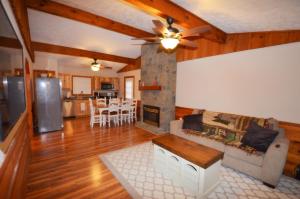 a living room with a couch and a fireplace at Tucked Away Cabin in Pigeon Forge