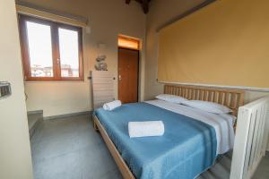 A bed or beds in a room at B&B A CASA DI ZIA LUISA