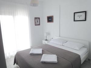 Posteľ alebo postele v izbe v ubytovaní Polychrono Nikos Apartment