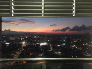 a view from the window of a city at night at DPerdana -Dinies pool,wifi, centre of Kota Bharu, 4-5 pax in Kota Bharu +18 photos