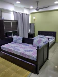 a bedroom with a bed and a tv in it at D'Perdana Apartment 2 in Kota Bharu