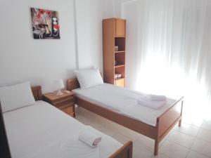 Posteľ alebo postele v izbe v ubytovaní Polychrono Nikos Apartment