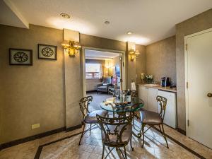 a kitchen and dining room with a table and chairs at The Avenue Plaza in Brooklyn