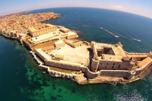 an aerial view of an island in the water at Casa Sveva in Siracusa