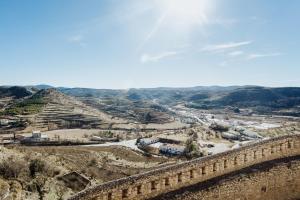 an aerial view of the ruins of the amphitheatre at Hotel El Cid in Morella