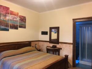 Postel nebo postele na pokoji v ubytování Agriturismo La Baita