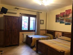 TV a/nebo společenská místnost v ubytování Agriturismo La Baita