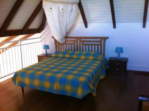 מיטה או מיטות בחדר ב-Coco D'Iles