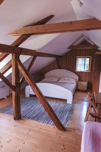 a bedroom with two beds in a attic at Mala Kmetija in Slovenske Konjice