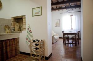 a kitchen and dining room with a table and a dining room at Agriturismo La Mela in Collevalenza +18 photos