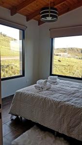 Ένα ή περισσότερα κρεβάτια σε δωμάτιο στο Altas Tierras de Ventania +30 φωτογραφίες