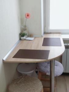 a wooden table in a small room with a table at Квартира in Tiraspol