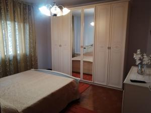 a bedroom with a bed and a dresser and a mirror at LA CARLOTTINA in Codevigo