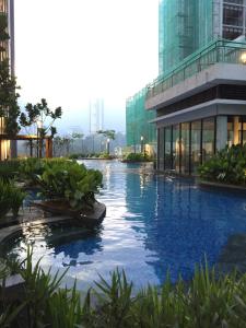 a swimming pool in the middle of a building at 12pax Golden Shine Homestay @Midhills Genting in Genting Highlands