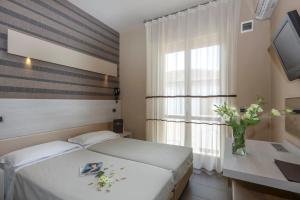 Postel nebo postele na pokoji v ubytování Hotel Rosenblatt