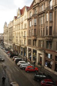 a row of cars parked in front of buildings at LVIV WALL STREET APT in Lviv