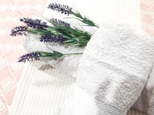 a white towel with a bunch of lavender on it at C´AN PICAFORT NEAR THE SEA in Can Picafort +163 photos