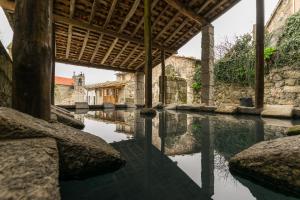 a view of a canal in an old building at Hostel Criativo do Sabugueiro in Sabugueiro