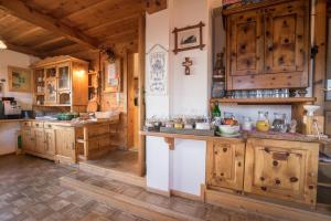 a large kitchen with wooden cabinets and a counter at Rücklhof in Schladming