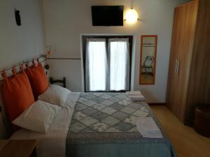 Postel nebo postele na pokoji v ubytování B&B L'Upupa