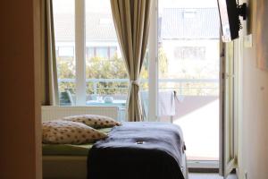 
Ein Bett oder Betten in einem Zimmer der Unterkunft Pension Jägerhof
